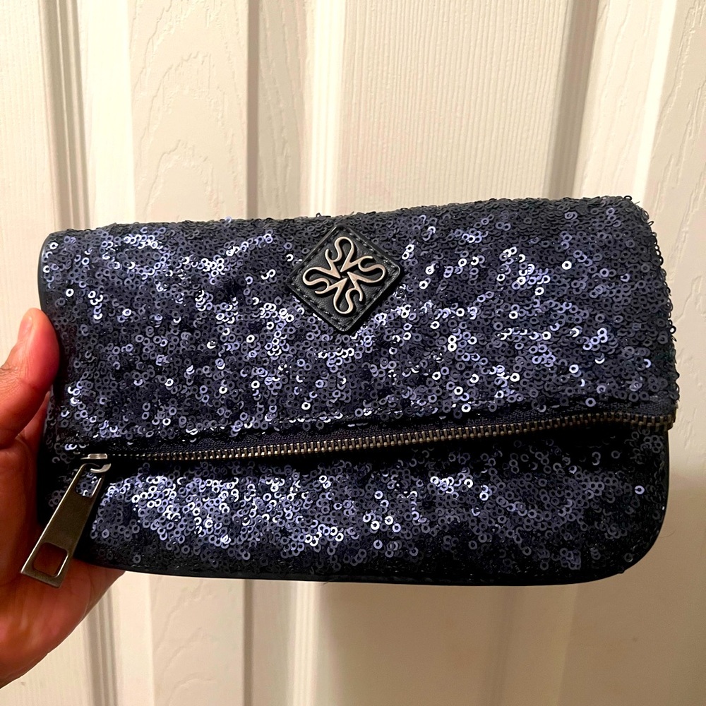 Vera Wang sequined clutch top
zipper with wristlet attachment . Never used